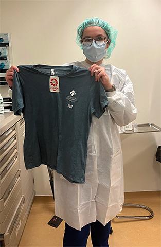 Vet tech intern, receiving her official DCM t-shirt